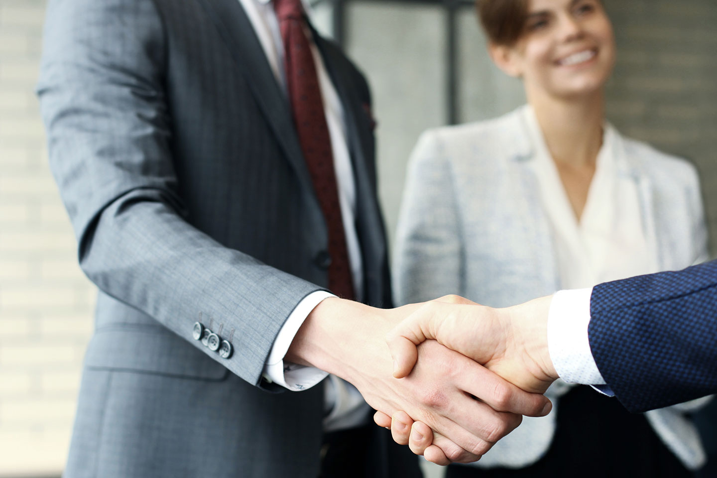 Sales rep shaking hands with customer
